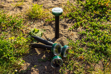 Solar-powered ultrasonic mole, mouse and snake repellents. Protection of the garden and garden beds from pests. Soft focus