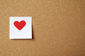 Red heart sticker on corkboard (1)