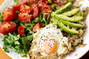 Ketogenic diet breakfast. Salt salmon salad with greens, cucumbers, eggs and avocado. Keto/paleo lunch.