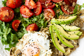 Ketogenic diet breakfast. Salt salmon salad with greens, cucumbers, eggs and avocado. Keto/paleo lunch.