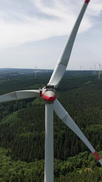 Wind Power, renewable resource, three blades in wind farm srtting. the foundation, the tower, the rotor and hub.