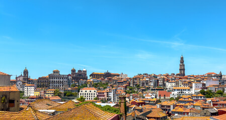 Porto panoramic view with Clerigos bell tower, traditional red tiled rooftops, baroque architecture,