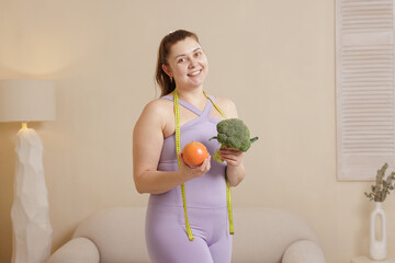 Happy Plus Size Woman Holding Broccoli and Grapefruit Diet Healthy Eating and Weight Loss Concept
