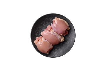 Raw chicken thigh fillet without skin and bone with salt and spices. Raw chicken fillet for cooking