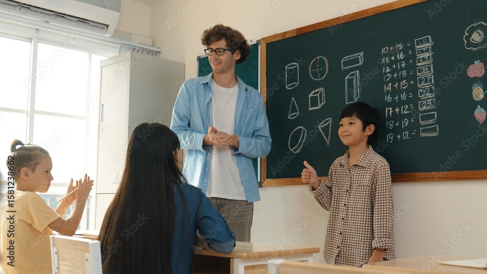 Poster student standing at in front of class and start to introduce himself at classroom while caucasian te