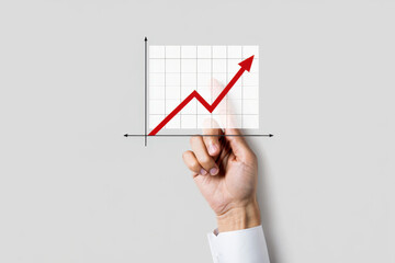 Hand Holding a Graph Showing Upward Trend A Visual Representation of Growth and Success Against a Plain White Background in a Business Context