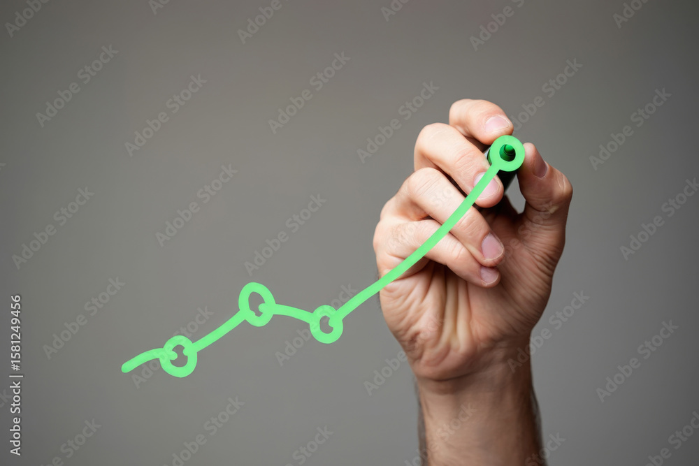 Poster visualizing progress a hand draws an upward trending line graph with circular data points in green o