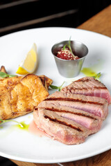 tuna steak in a pan on the table, vegetarian fish dish