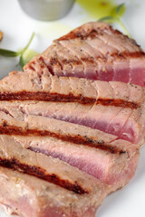 tuna steak in a pan on the table, vegetarian fish dish