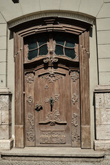 An Intricate and Beautiful Antique Wooden Door Adorned with a Decorative Design that Captivates