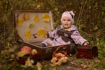 baby in the forest in autumn.