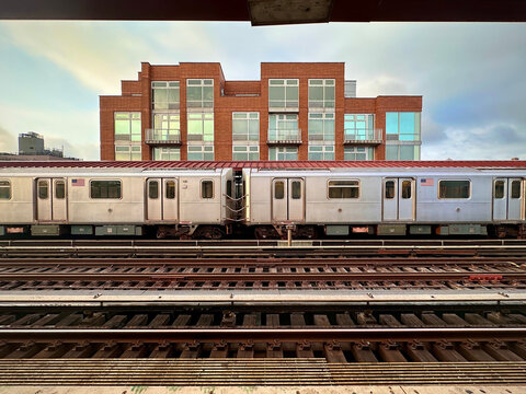 Elevated Subway Train and Apartment Building (Queens, New York, USA ) - Powered by Adobe