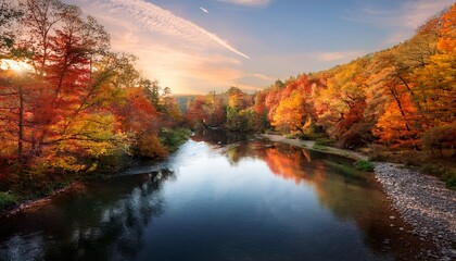 a peaceful river winding through a forest of colorful autumn trees the warm tones of fall leaves and calm water create ideal copy space
