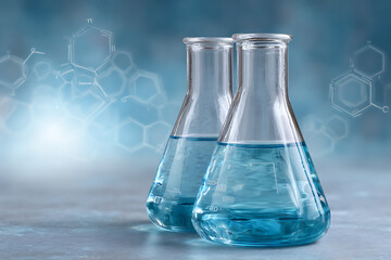 Two Erlenmeyer Flasks Filled with Light Blue Liquid Closeup Shot Science Laboratory Experiment Chemistry Research Glassware