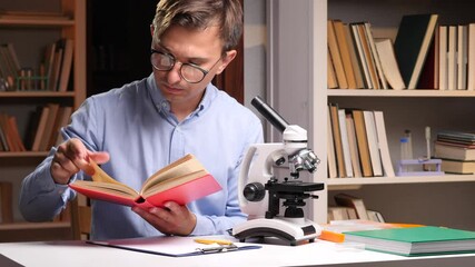 Scientist reading a book and studying with a microscope in a library - Powered by Adobe