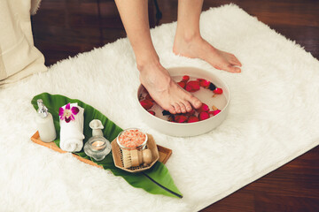 Man indulges in blissful foot massage at luxurious spa salon while masseur give reflexology therapy...