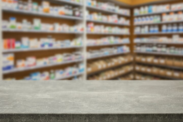 Empty wooden counter with copy space in front of blurred pharmacy shelves with medicines....