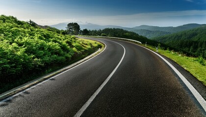 Obraz premium serene winding road surrounded by lush greenery