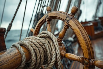 Close-up of a weathered wooden ship's wheel, ropes, and nautical details