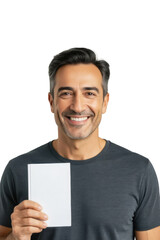 A smiling man in a gray t-shirt holds a blank white card against a neutral background.