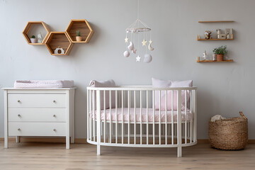 Minimalist Baby Nursery Featuring White Crib Pink Bedding Wooden Shelves and Mobile Pastel Colors Light Grey Walls