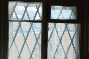Exploring Geometric Window Design Featuring an Intricate Cross Pattern for Aesthetic Appeal