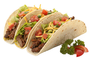 Three beef tacos with fresh toppings on flour tortillas isolated on transparent background.. Ideal for concepts of Mexican cuisine, food photography, and culinary arts