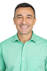 A smiling middle-aged man with short dark hair and a light green shirt looks directly at the camera in a studio portrait.