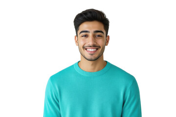A young man with dark hair and a warm smile confidently gazes directly at the camera, wearing a turquoise sweater against a soft gray background.