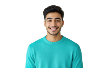 A young man with dark hair and a warm smile confidently gazes directly at the camera, wearing a turquoise sweater against a soft gray background.