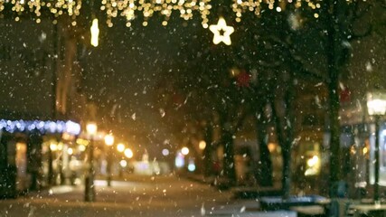 Christmas city lights illuminate snowy streets as festive atmosphere fills the air. Winter in the city. Cozy atmosphere of winter city decorated with Christmas decorations and lights - Powered by Adobe