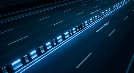 Nighttime Highway View With Illuminated Road Dividers And Directional Arrows