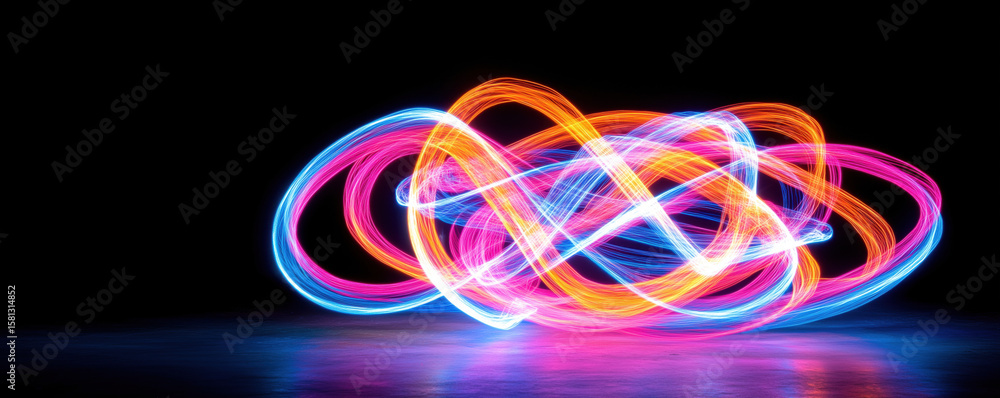 Poster colorful light trails creating abstract patterns in dark background.