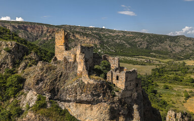 Aerial view of Ruins of Drisi Fortress in Georgia with panoramic mountain and valley views