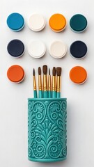 Artist's colorful paint and brush set with watercolors for creative drawing and school art