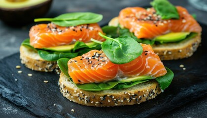 Delicious Open-Faced Sandwich Featuring Salmon, Spinach, And Avocado - A Nutritious And Flavorful Combination For A Healthy Meal.