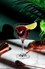 Irish Jack Rose alcoholic cocktail drink with Irish whiskey, calvados, lime juice, grenadine and lime slice