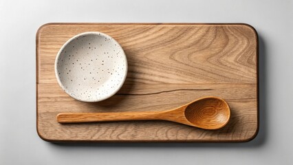 Antique wooden cooking utensils, including spoons and ladles, are isolated on a rustic brown wooden table