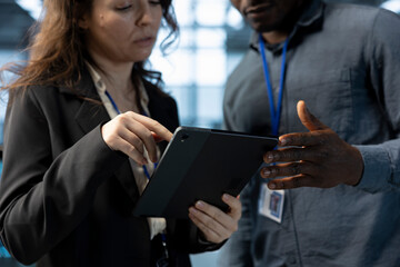 Data center software developers using laptop, conducting security audits, preventing errors. Close...