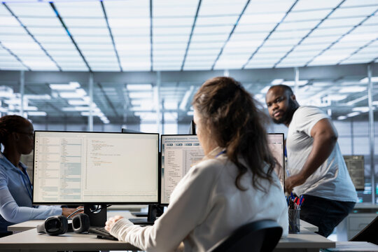 Computer scientist in data center office uses artificial intelligence neural networks doing computing processes. IT specialist working on PC with AI machine learning algorithms
