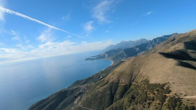 Powered paragliding paramotor flying over Albanian coast mountains and beaches aerial panorama landscape view,Albania,Balcan