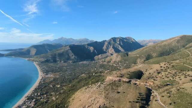 Powered paragliding paramotor flying over Albanian coast mountains and beaches aerial panorama landscape view,Albania,Balcan