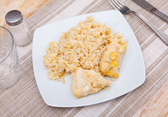 Rice and meat are served on table for lunch. Basmati rice with pieces of baked boiled breast. Homemade lunch, healthy diet food
