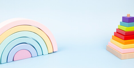 Educational wooden kid toys on light blue background. Montessori toys designed for educational and sensory play for children