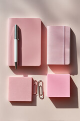 minimalist studio shoot featuring collection of stationery items arranged elegantly