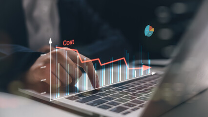 A businessman analyzing long-term cost reduction with a digital financial chart on a laptop....