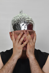 portrait of a man with  tinfoil hat