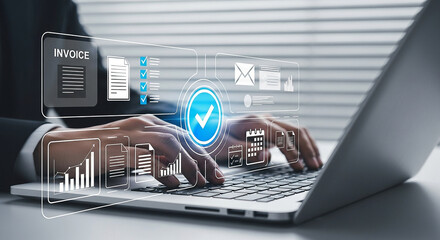 A businessman works on a laptop, interacting with a digital interface displaying invoice and workflow management elements