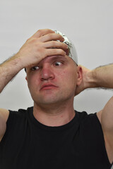 portrait of a man with  tinfoil hat