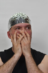 portrait of a man with  tinfoil hat